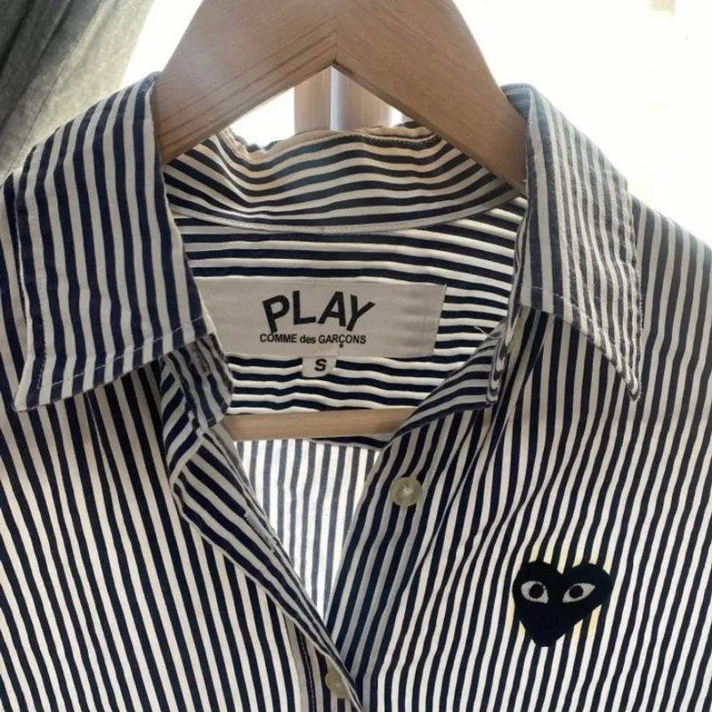 harga baju comme des garcons