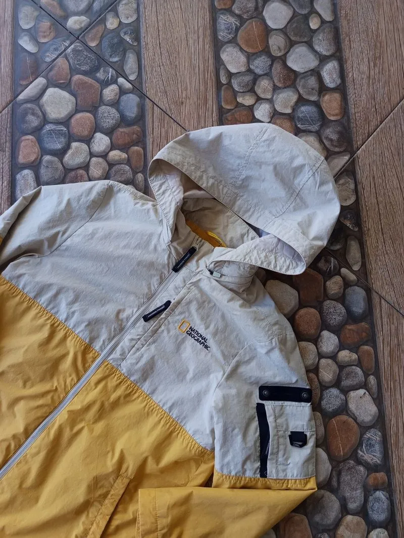 National Geographic outdoor waterproof jacket in cream and y photo 1