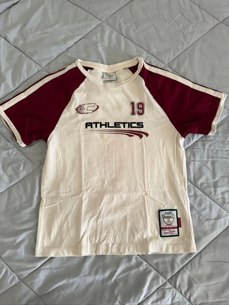 Celcius woman maroon & cream boxy athletics jersey photo 1