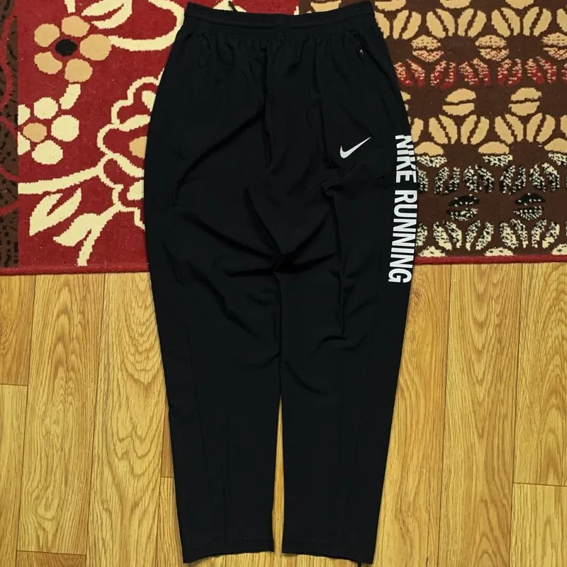 Item(s): NIKE REFLECTIVE RUNNING PANTS photo 1