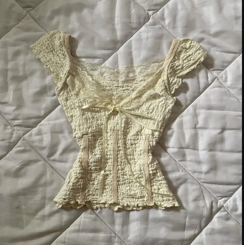 cream bow blouse photo 1