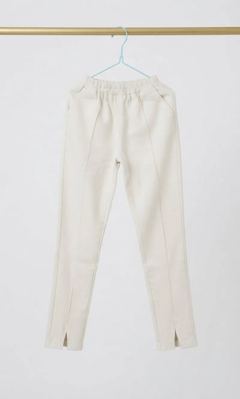 Minimalist Cream Slit-Hem Trousers Preloved photo 1