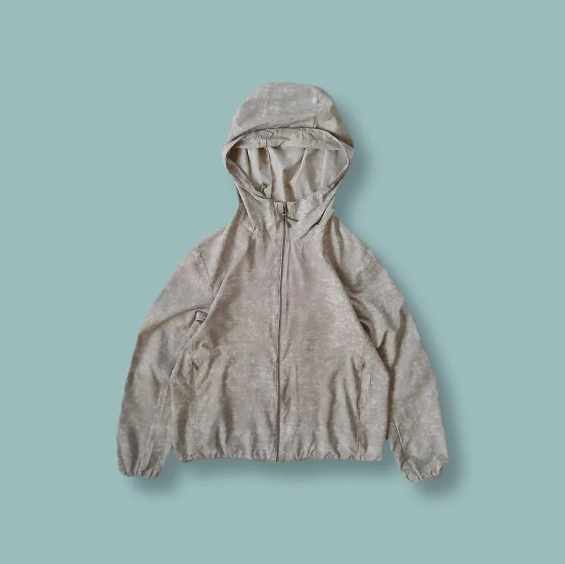 Jaket Parasut Lightweight Uniqlo UV Cut Abu Motif Second  photo 1