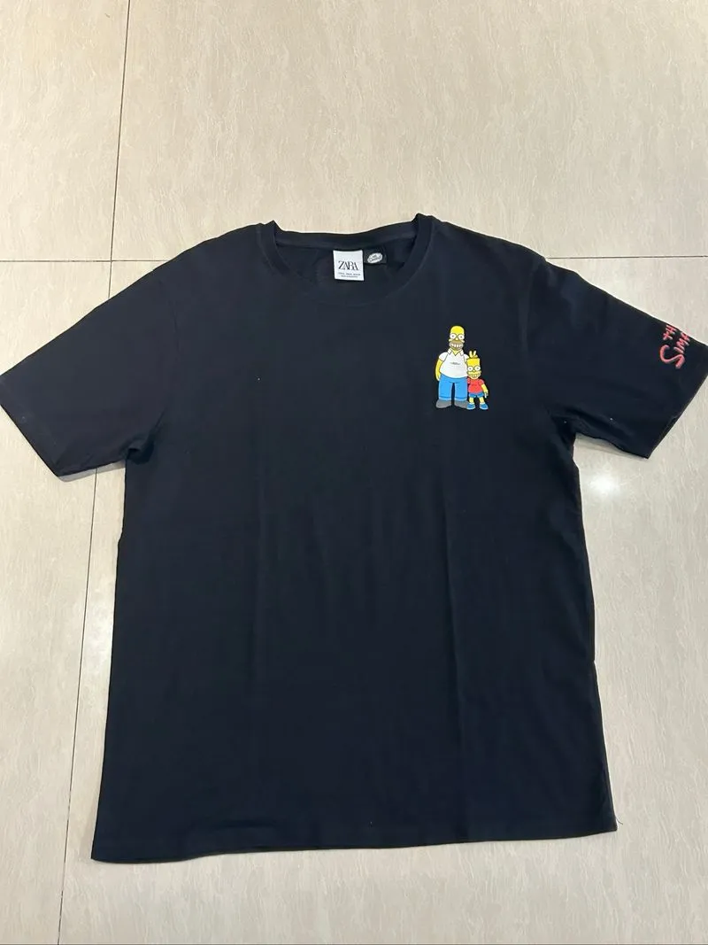 graphic t-shirt is from the Zara x The Simpsons collaboratio photo 1
