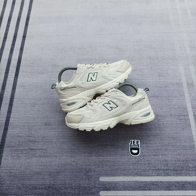 New Balance Casual Sneakers Wanita cream photo 1