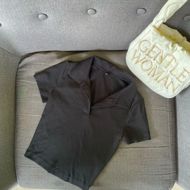 Polo uniqlo hitam photo 1