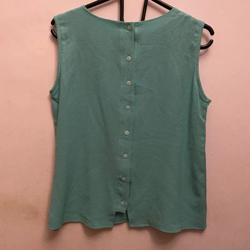 green sleeveless shirt photo 1