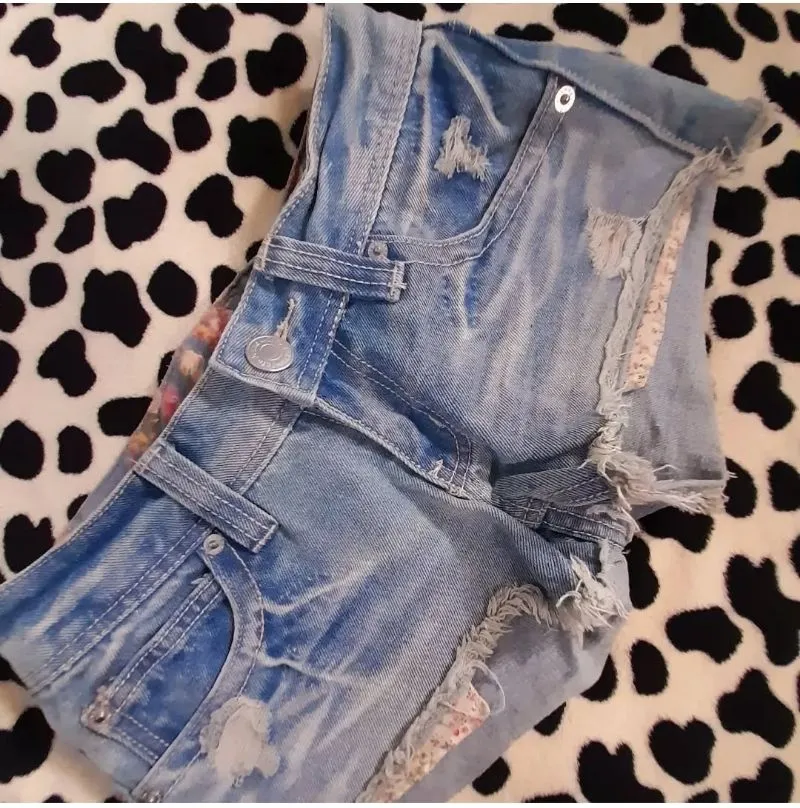 Ripped light wash denim short photo 1