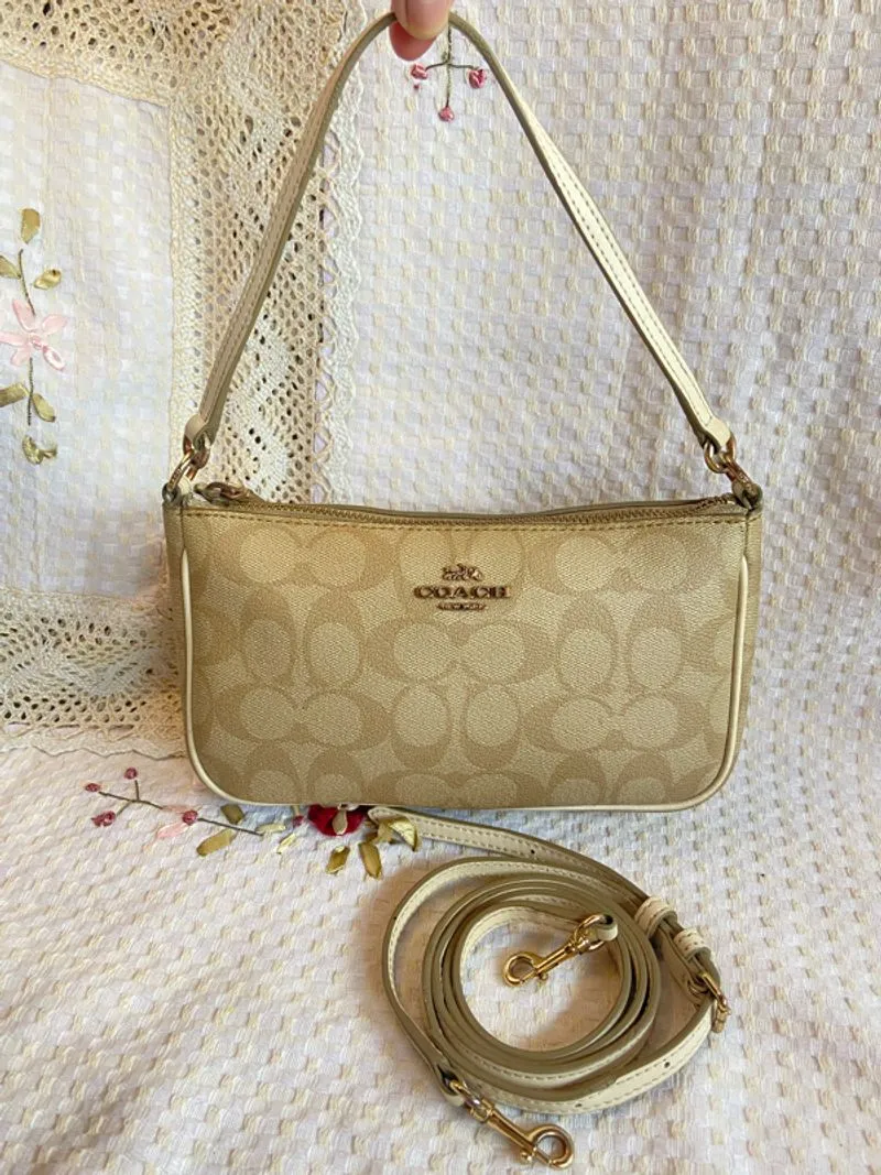 Coach sling hand bag in signature cream photo 1
