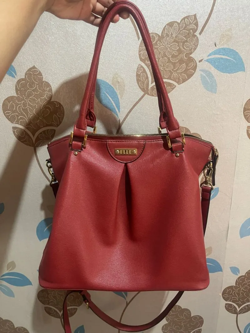 Elle handbag with a top handle and shoulder strap photo 1