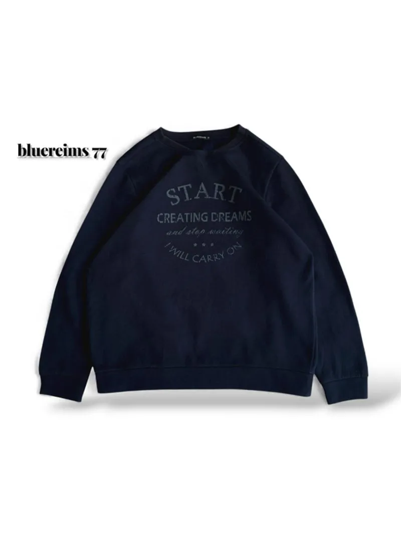 crewneck bluereims 77 berwarna biru tua dengan tulisan “STAR photo 1