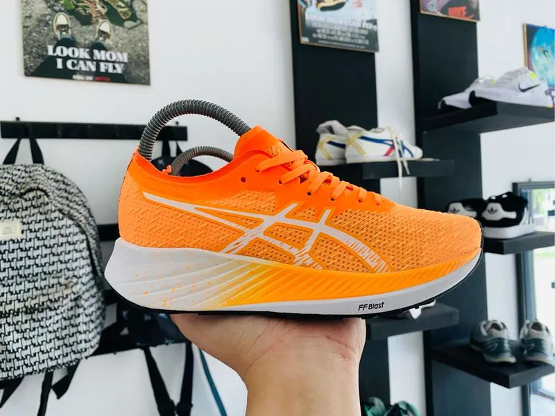 asics magic speed orange running photo 1