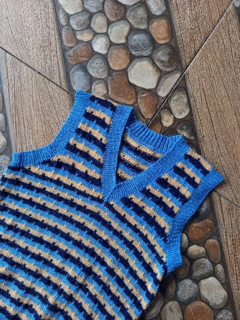 Unisex Suri Sweater Knit V-neck knit vest in blue and cream. photo 1