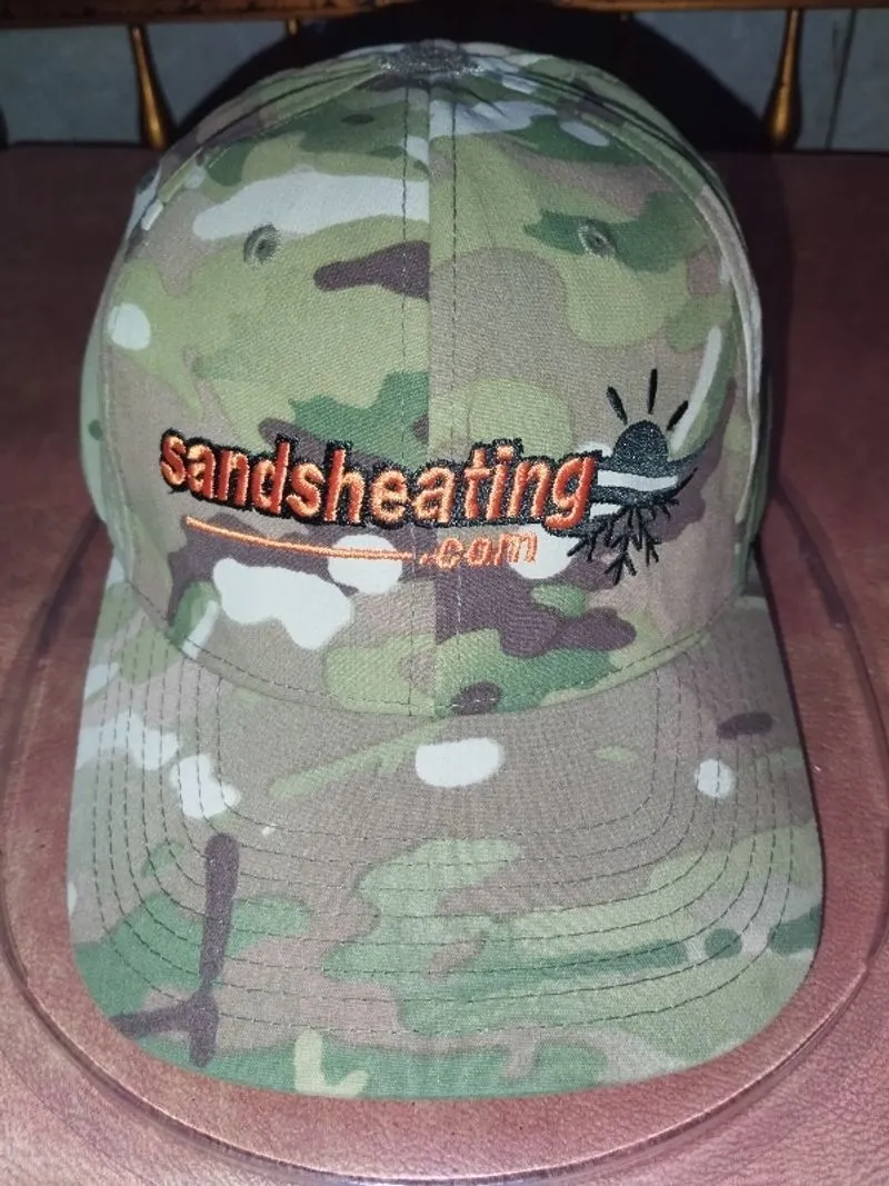 Camouflage Flex Fit hat with orange embroidered logo photo 1