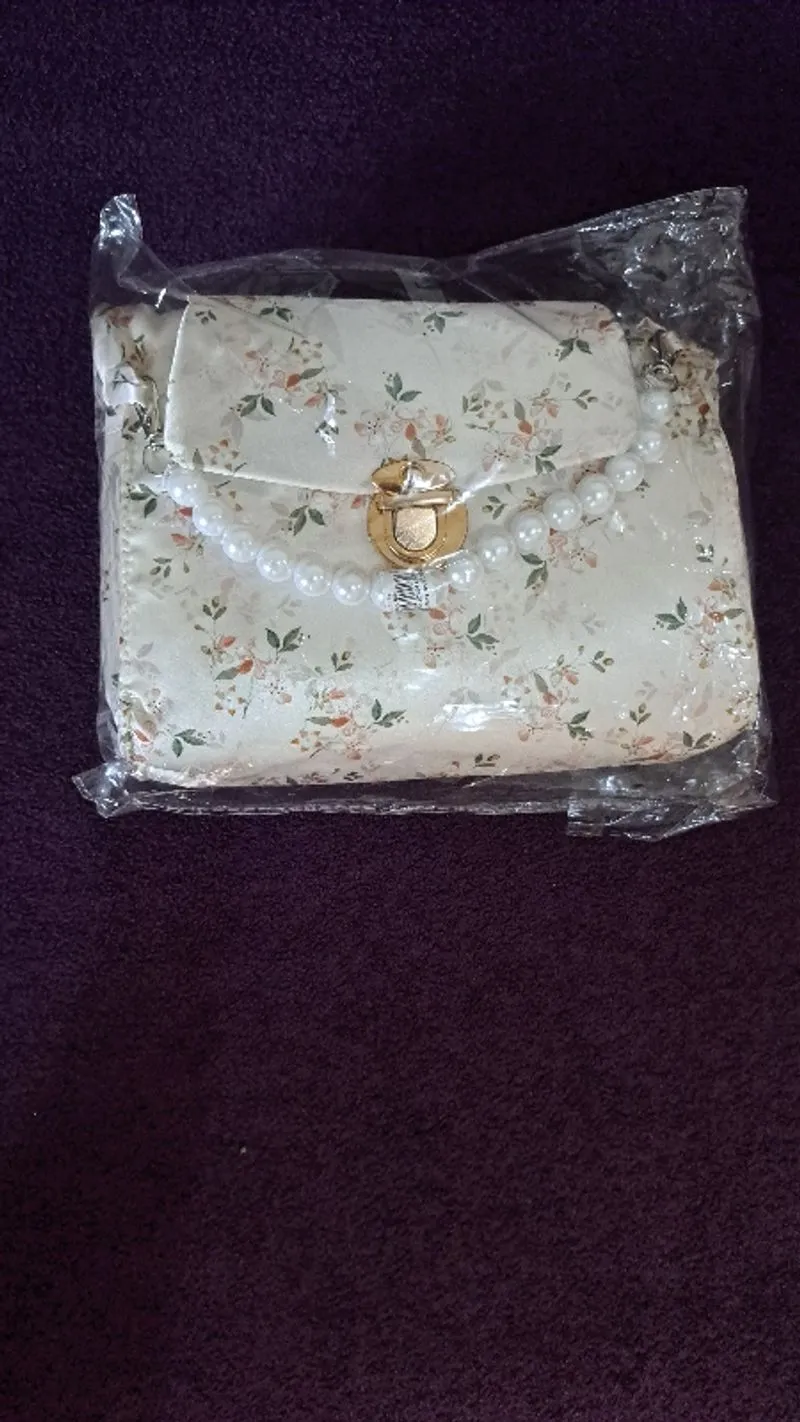 Jual mukena tas mutiara bahan armany photo 1