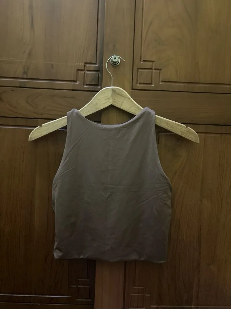 Brown tank top photo 1