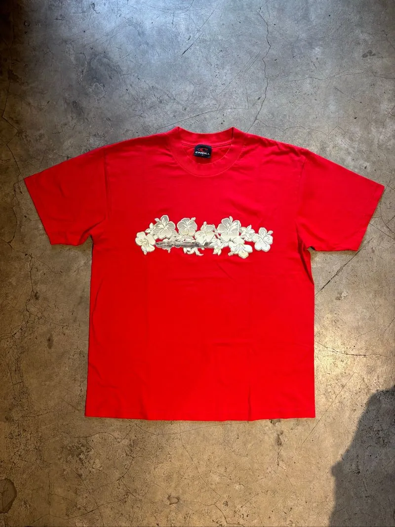 red short-sleeve O'Neill t-shirt featuring a white hibiscus  photo 1